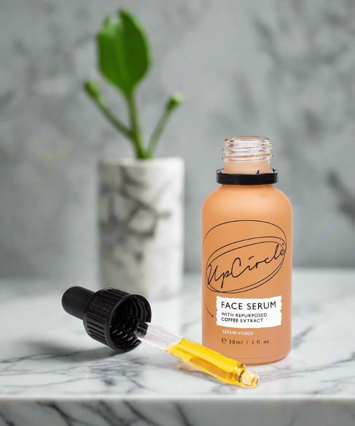 Face serum with repurposed coffee extract